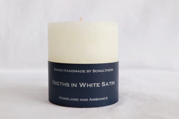Handicraft scented candle by Schulthess Kerzen from Switzerland. White color with soft and woody scent