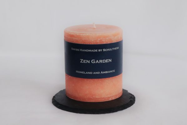 Handicraft scented candle by Schulthess Kerzen from Switzerland. Orange color with floral scent