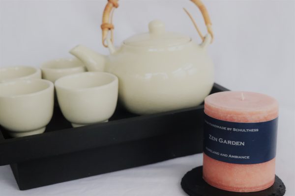 Handicraft scented candle by Schulthess Kerzen from Switzerland. Orange color with warm, floral and aromatic scent 