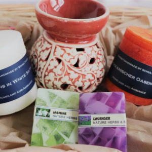 Gift set handicraft with soaps, scented candles and oil candle burner
